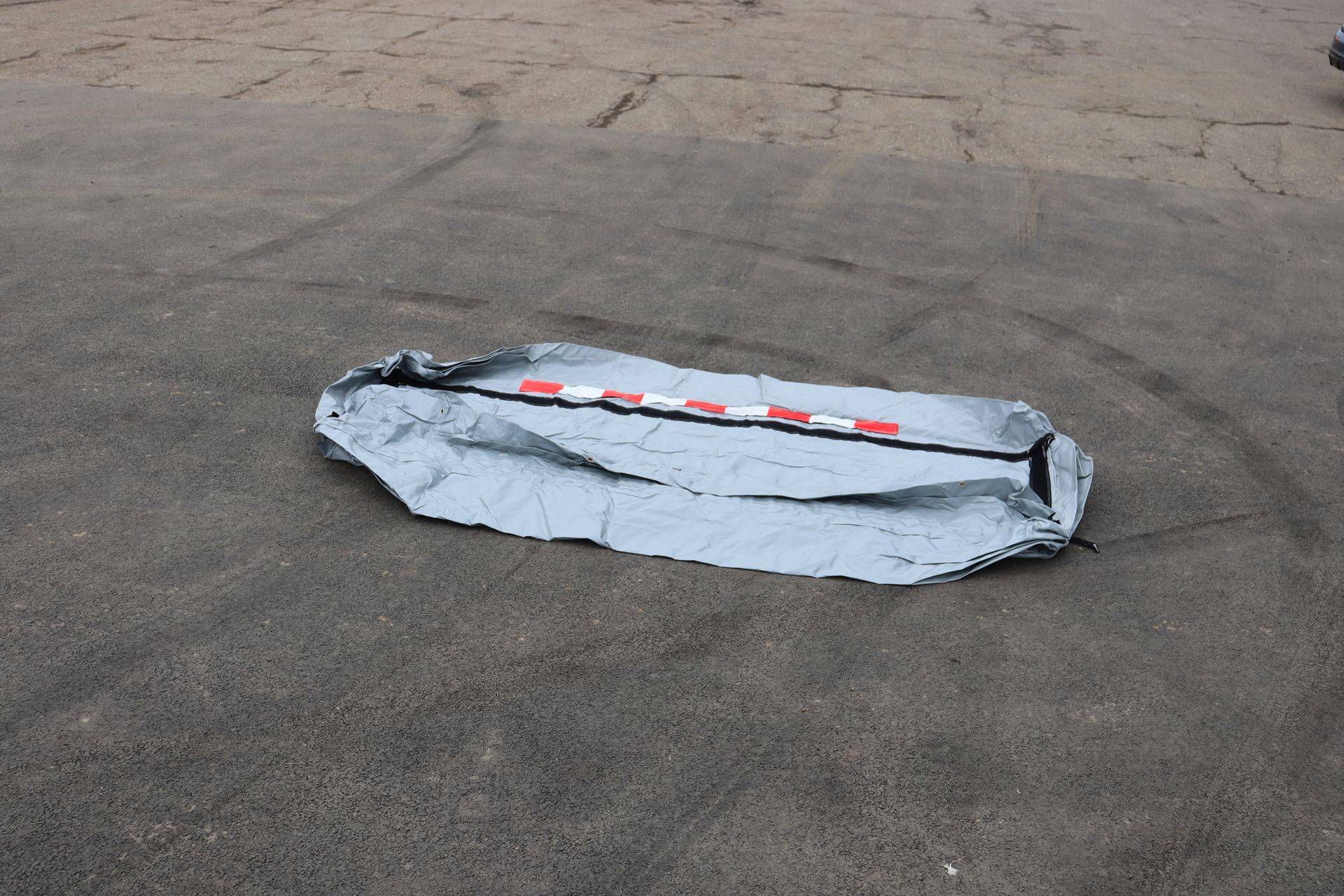 InflatorShield unit flat and deflated — compact for transport and storage