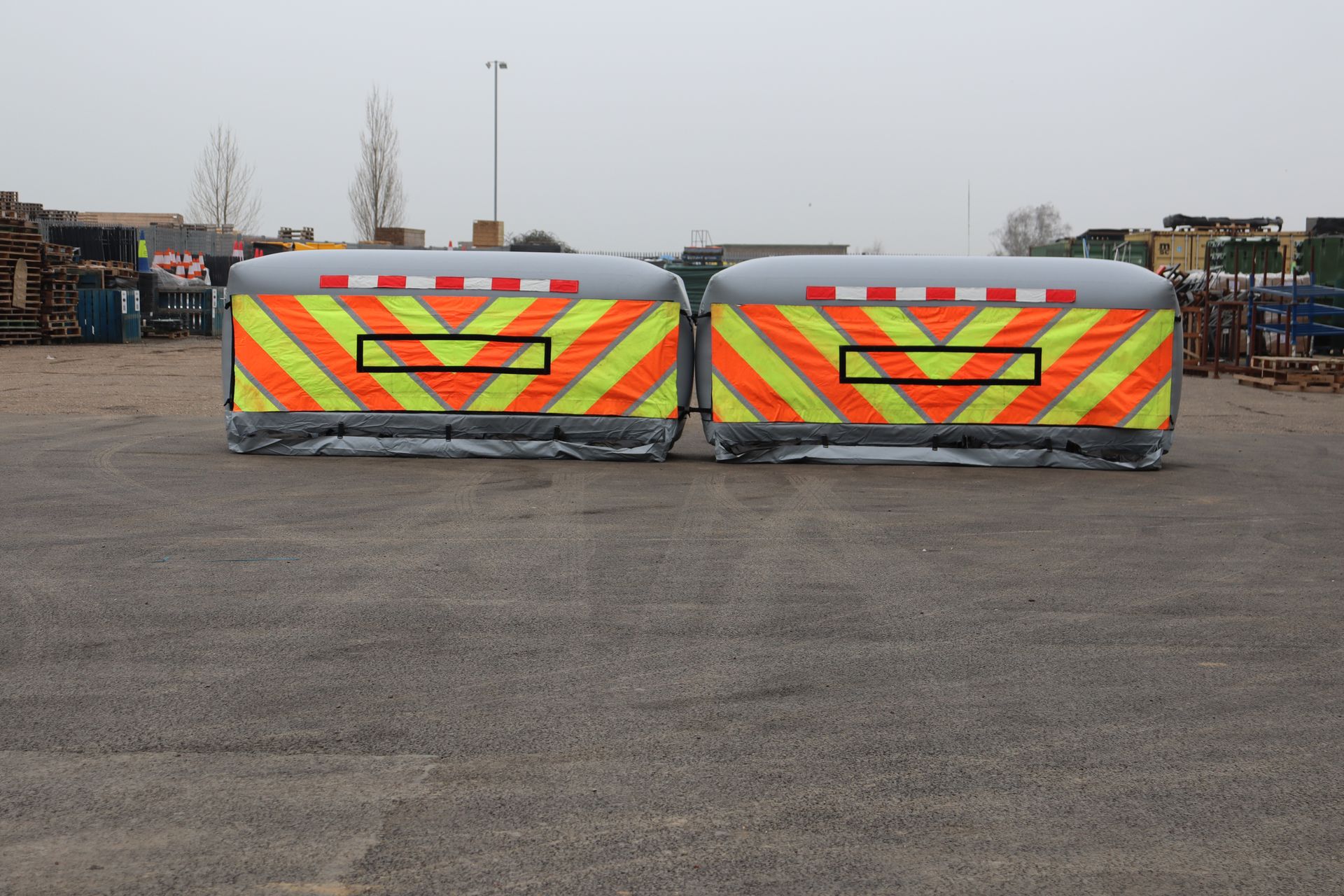 Two InflatorShield units deployed side by side on tarmac, showing full lane coverage